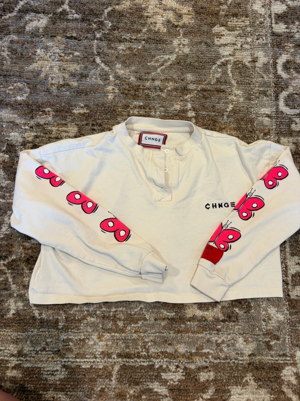 CHNGE Cream Long-Sleeve Henley with Pink Butterfly Sleeve Prints